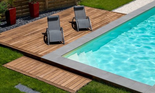beautiful swimming pool and exotic wooden terrace with sunbath chair